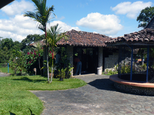 The reception and office building is to the left of the aviary.